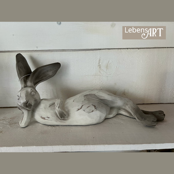 Hase liegend grauweiss gewischt